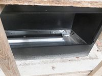 Front opening and housing of fireplace insert showing vent area