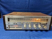 Front view of Marantz SR 4000 stereo receiver showing silver front panel with tuning dial, knobs, switches and illuminated meter