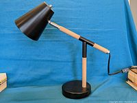 Side view of the retro desk lamp showing entire assembly and cord with switch.