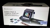 Box front showing the Brookstone iConvert Instant Slide and Negative Scanner with built-in screen and sample images.