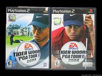 Two PlayStation 2 game cases for Tiger Woods PGA Tour 2003 and 2004 side by side, showing cover art and titles.