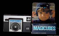 Kodak Instamatic X-15 camera next to a box of new Sylvania Magicubes flash cubes.