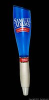 Full view of the blue Samuel Adams Boston Lager beer tap handle showing its height and branding.
