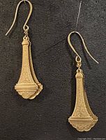 Pair of antique brass earrings on gold plated ear wires shown front view