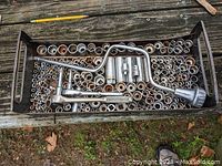Tray full of metric and inch sockets with 1/4" and 3/8" drives including ratchets and T-handle driver