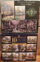 Photo of Thomas Kinkade jigsaw puzzle set box showing 10 puzzles with various scenic artwork.