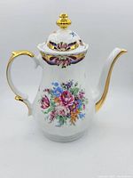 Front view of Limoges coffee pot showing floral handpaint and gold detailing