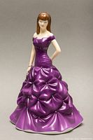 Front view of Royal Doulton purple gown porcelain figurine showing detailed dress and facial features.