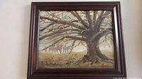 Photo showing full framed oil painting of large bare tree with riders on horseback in background. Painted by John Leone.