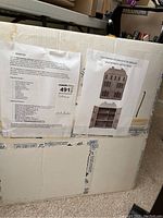 Photo of box label showing product description, features, and assembly details.