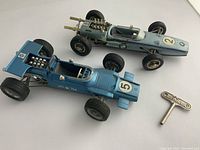 Overhead view of both cars and winding key