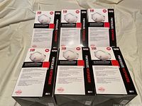 Front top view showing six boxes of N95 valved particulate respirators with markings and label information visible.