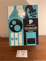 Box front showing Porter Microcraft microscope graphics and model No. 260.