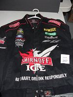 Front view of black racing jacket with large Smirnoff Ice logo and other sponsor logos embroidered on front and sleeves.