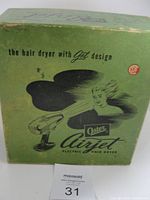 Original vintage green box for Oster Airjet hair dryer with retro graphics and branding.