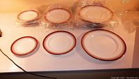 All three plate sizes arranged with one of each size front and stacks behind
