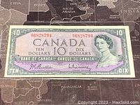 Front side of the 1954 Canadian ten dollar banknote with Queen Elizabeth II's portrait and serial number.