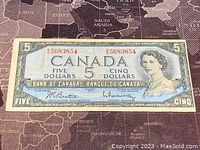 Front of 1954 Canadian $5 banknote showing Queen Elizabeth II and denomination details.
