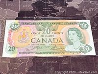 Front side of 1979 Canadian 20 dollar banknote showing Queen Elizabeth II portrait and coat of arms.