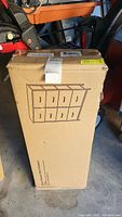 Boxed fabric dresser with 8 drawers, sketch on box showing design and structure, black color.