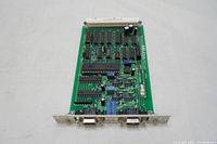 Full view of the Mitutoyo green printed circuit board showing integrated circuits, capacitors, resistors and dual DB9 connectors.