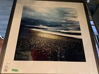 Front view of color coastal seascape print in dark frame