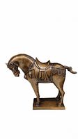Front side view of the bronze horse sculpture showing details of the head, saddle, and base