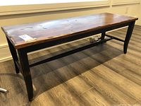 Front and side view of the coffee table showing overall shape and base construction