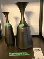Front view of both vases with green size labels 10 and 12 visible