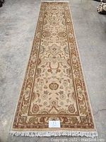 Full length view of the runner laid flat on concrete floor