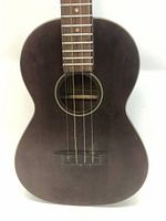 Front view of 23 inch wooden ukulele with dark wood finish, showing sound hole and strings.