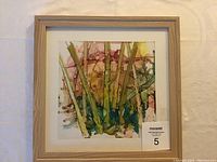 Framed abstract alcohol ink painting on Yupo paper, signed by Gabriele Craig, showing colorful tree-like forms and natural wood frame.