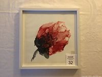 Framed alcohol ink artwork titled 'Imaginary Rose' showing abstract red and pink rose design on white Yupo paper with white frame.