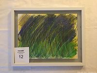 Framed original watercolour painting with visible signature and abstract nature-inspired colors in green, dark purple, blue, and yellow
