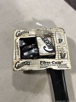 Close-up of Chopper1 ax head and original packaging with instructions and branding.