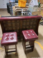 Rear view of bar front panel and two stools