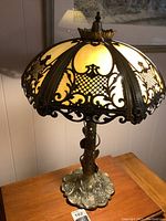 Full view of lamp illuminated on table