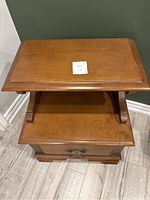 Top angled view showing the surface, open shelf, and drawer top edge.