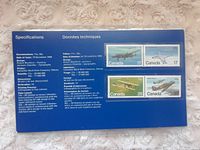 Blue backing card with technical specifications and image of four airplane stamps: Avro Lancaster, Avro Canada CF-100, Curtiss JN-4 Canuck, Hawker Hurricane.