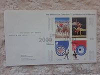 Full sheet showing all four stamps and day of issue details.