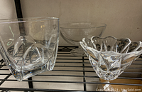Three crystal pieces including Orrefors vases and bowls along with a Waterford bowl