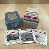 Blue box labeled 'Civil War Cards' filled with many historical Civil War themed cards standing upright inside the box on a wood surface.