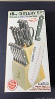 Photo of the box showing 15-piece cutlery set including Santoku 3-in-1 chef knife with packaging and features highlighted.