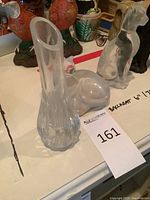 Bud vase with two cat figurines behind