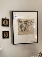 Overview shot showing the large framed etching alongside two smaller silhouette portraits