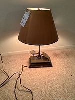 Full view of lamp showing shade, stem, base and power cord