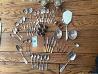Full lot arranged on wooden surface showing all items