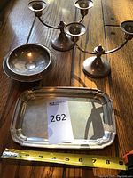 Overview of entire lot showing tray, candy dish and both candlestick holders on wooden table