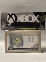 Photo of XBOX icon light in original box with box front showing Xbox official branding