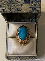 Top-down view of ring in presentation box showing overall design